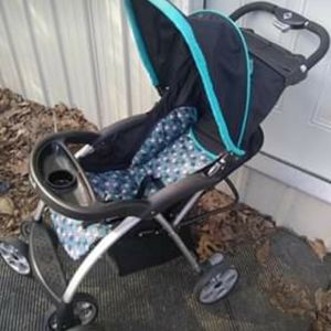 Baby stroller a baby seat and little boys jacket